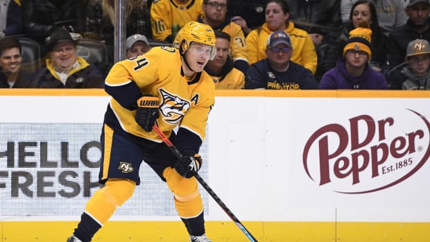 Jan 11, 2022; Nashville, Tennessee, USA; Nashville Predators center Mikael Granlund (64) skates against the Colorado Avalanche during the first period at Bridgestone Arena. Mandatory Credit: Steve Roberts-USA TODAY Sports